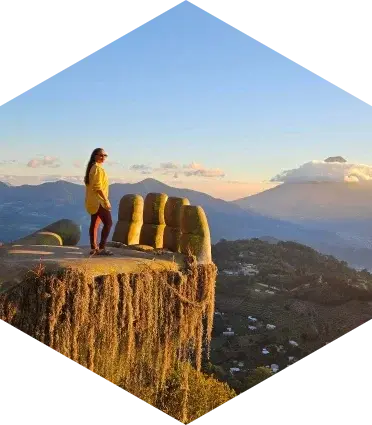 woman on top of a hand mountain